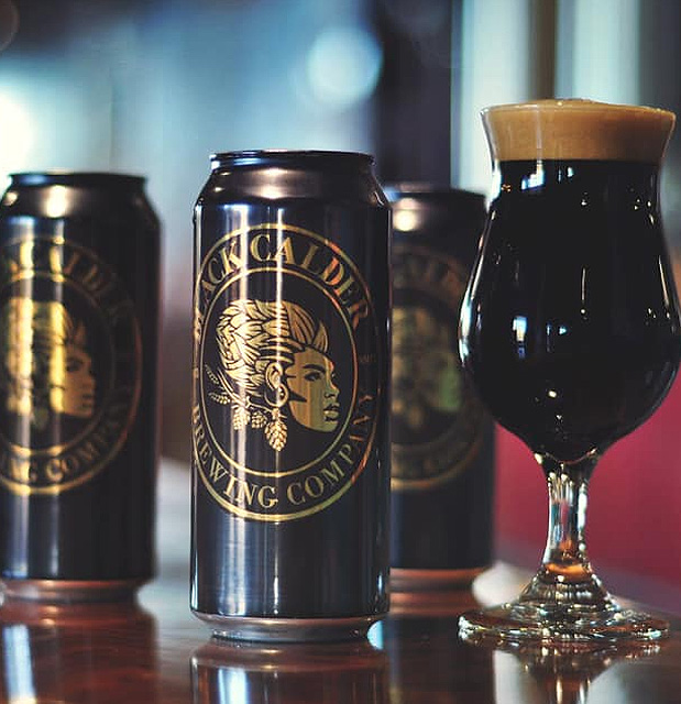 cans of beer with black calder brewing logo